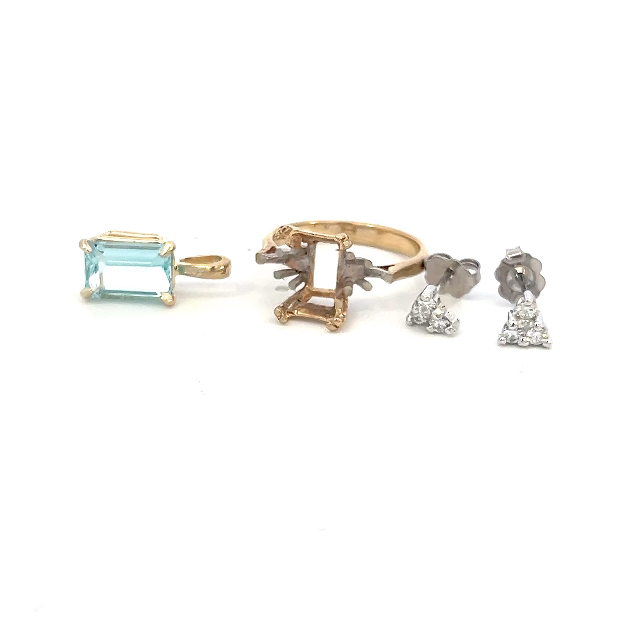 An aquamarine pendant, the ring setting its stone came from, and a pair of diamond earrings